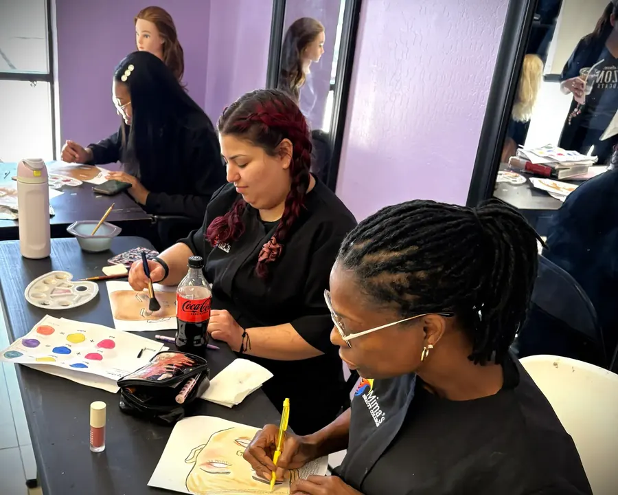 Esthetics and makeup student practicing